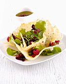 Lettuce with raspberries in a parmesan bowl