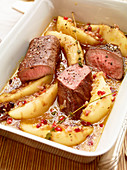 Oven-roasted saddle of venison with lingon berry pears