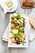 Spring salad with beans and baked goat's cheese