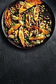 Spicy sweet potato and chickpea bake with lime tahini dressing