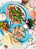 A mid-summer buffet with chicken salad, rocket, radishes and fruit salad (Sweden)