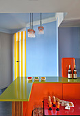 Colourful breakfast bar in kitchen with blue walls