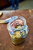 Sauerkraut with bacon in a glass jar