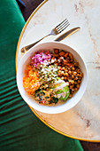 Vegan bowl with quinoa, buckwheat and tahini dressing