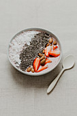 A smoothie bowl with berries and chia seeds