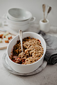Gluten-free crumble with strawberries, rhubarb, oats, walnuts, cinnamon and coconut oil