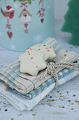 Napkins tied with gold cord and peppernut biscuits