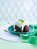 A piece of peppermint chocolate ice cream cake on plate