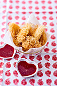 Kataifi coated chicken strips with dips in heart shaped bowls