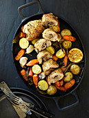 Chicken breast with root vegetables, garlic and herbs