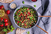 Tabbouleh with pomegranate seeds and sesame seeds (Arabia)