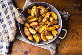 Roasted potato wedges with caraway seeds (top view)