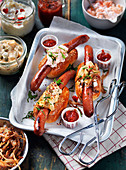 Hot dogs with crab salad, remoulade sauce, and roasted onions