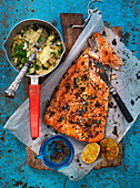 Oven roasted salmon fillets with herb couscous and grilled lemons