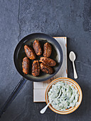 Cevapcici with a sheep's cheese dip
