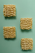 Mie noodles on a coloured surface (seen from above)