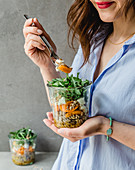 Noodle salad in a glass with apricots and rocket
