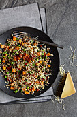 Colourful quinoa with vegetables and alpine cheese