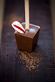 A hot chocolate stick with a piece of candy cane