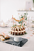 Bundt cake with garland on modern table set for Christmas
