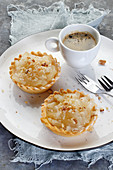 Apple tarts with walnuts, served with coffee