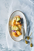 Roasted cauliflower with almond puree, apple capers, pickled cucumber and spring onion