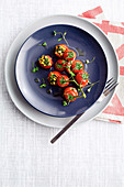 Vine tomatoes stuffed with anchovies, olives and capers