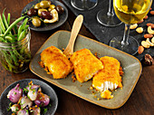 Breaded cod with marinated vegetables