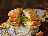 A sandwich with fish in panko breadcrumbs