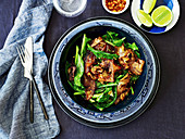 Charred rice noodles and Asian greens