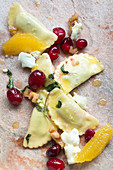 Ravioli with goat's cheese, oranges and cranberries