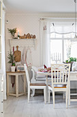 Table and chairs in festively decorated kitchen-dining room