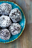Vegan chocolate balls with seeds and grated coconut (Raw Baking)