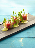 Rice paper rolls with vegetables, marinated tuna and rocket cream