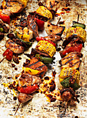 Kebabs with meat, corn and vegetables