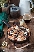 Chocolate snails baked in a pan with white chocolate