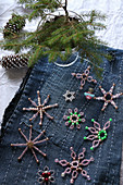 Bead stars on denim embroidered with lines
