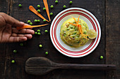 Mashed potatoes with peas and carrots