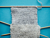 A sock being knitted: heel flap knitted in stocking stitch
