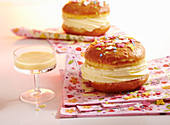 A glazed carnival doughnut filled with eggnog cream