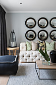 Round convex mirrors on wall of elegant living room