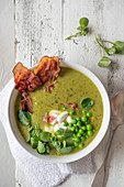 Pea and watrcress soup with crispy air dried ham and cream