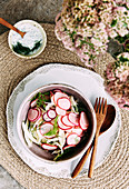 Clean eating fennel and pink raddish salad with a dill and yogurt dressing