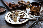 Handmade truffle pralines with chocolate sauce