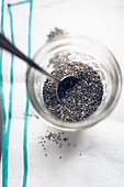 Chia seeds in a glass with a spoon