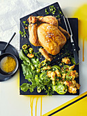 Roast chicken with bread, olive and lemon stuffing; Bread, green tomato and olive salad