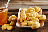 Mushroom-shaped fortune cookies with almonds and warm tea punch