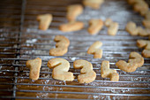 Christmas biscuits shaped like numbers 1-4 on cooling rack
