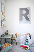 Letter R above desk and chair in child's bedroom