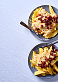 French fries with cheese sauce and crispy bacon